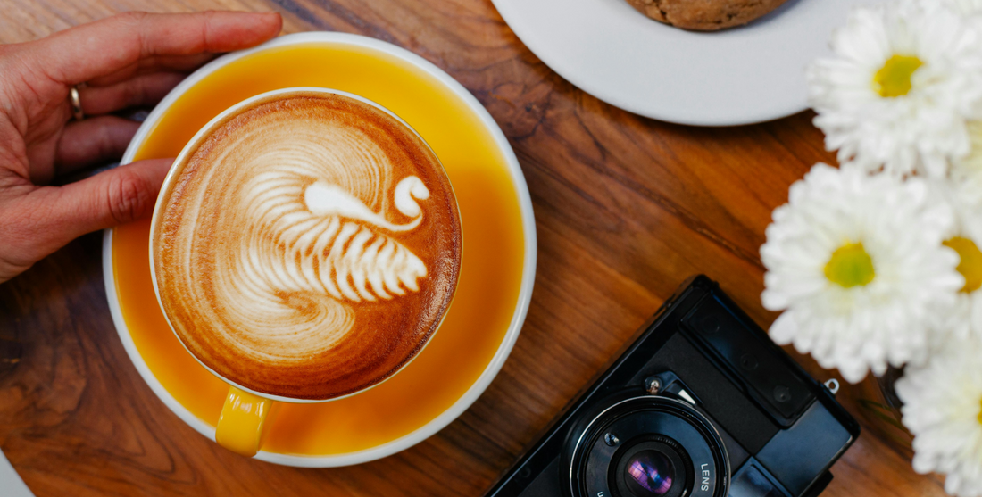 Latte art done on cup of specialty coffee